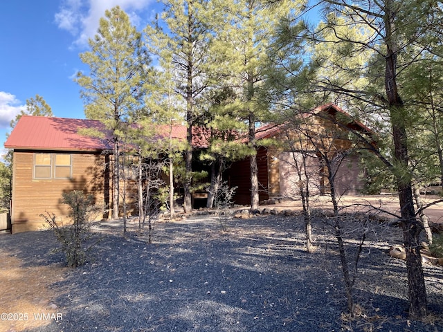 view of front of property featuring metal roof