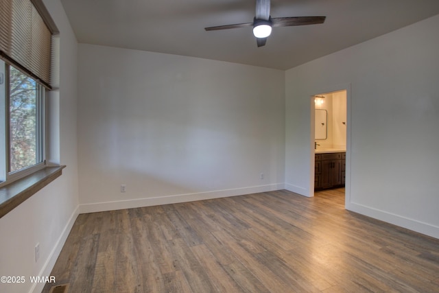 2071 N Bison Pass Ct, Show Low, AZ 85901 - unfurnished room featuring wood finished floors, ceiling fan, and baseboards