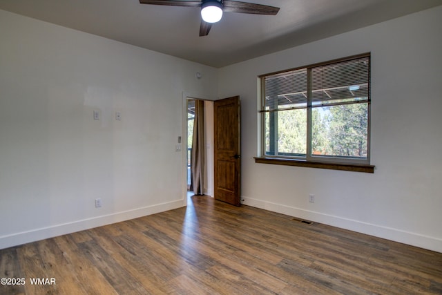 2071 N Bison Pass Ct, Show Low, AZ 85901 - empty room featuring baseboards, ceiling fan, and wood finished floors