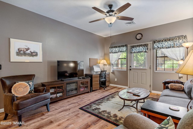 2385 Quarter Horse Trl, Overgaard, AZ 85933 - living room featuring light wood-type flooring and ceiling fan