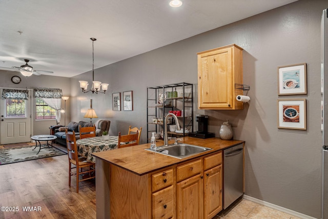 2385 Quarter Horse Trl, Overgaard, AZ 85933 - kitchen featuring stainless steel dishwasher, open floor plan, ceiling fan, a chandelier, and light wood-type flooring