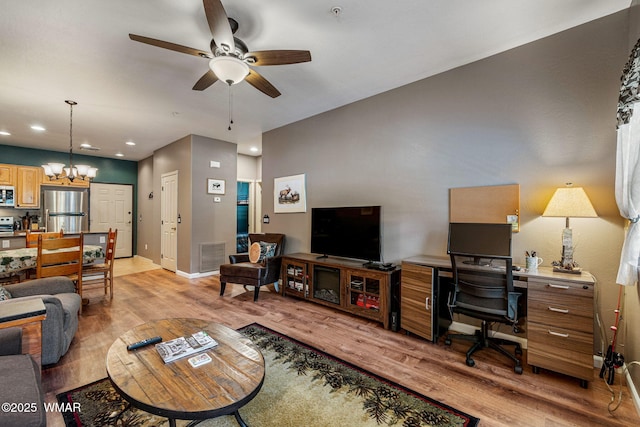 2385 Quarter Horse Trl, Overgaard, AZ 85933 - living room with light wood-type flooring, a ceiling fan, a desk, a chandelier, and recessed lighting