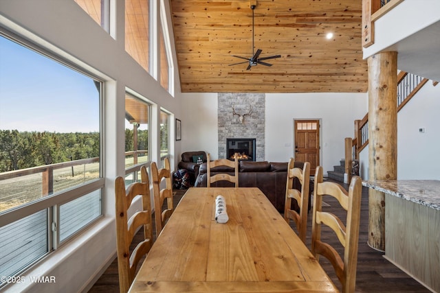 3457 Carefree Rd, Heber, AZ 85928 - dining area featuring high vaulted ceiling, a ceiling fan, a stone fireplace, wood finished floors, and stairs