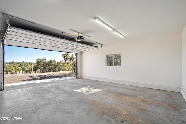 3457 Carefree Rd, Heber, AZ 85928 - garage featuring a garage door opener and baseboards