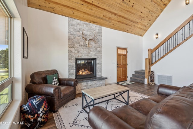 3457 Carefree Rd, Heber, AZ 85928 - living area featuring wood finished floors, a fireplace, wood ceiling, high vaulted ceiling, and stairs