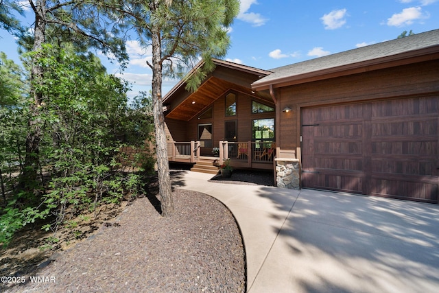 4611 Stonecrop Ln, Show Low, AZ 85901 - view of front facade featuring an attached garage and stone siding