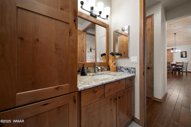 4611 Stonecrop Ln, Show Low, AZ 85901 - bathroom featuring vanity, wood finished floors, and a chandelier