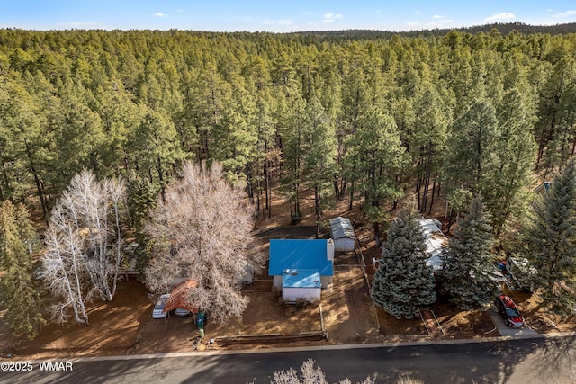 drone / aerial view with a view of trees