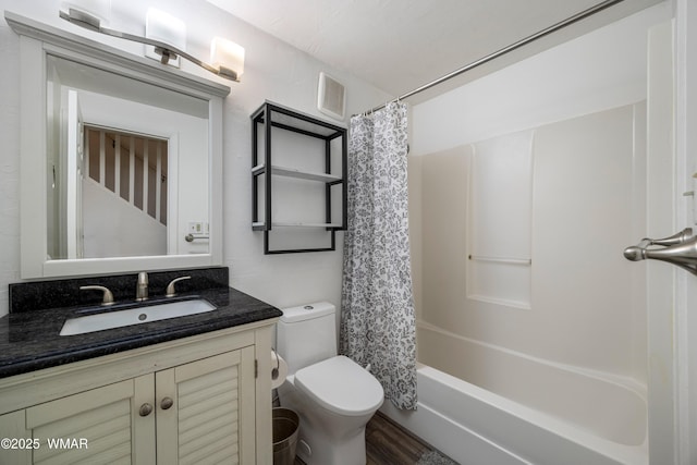 bathroom featuring visible vents, vanity, and toilet