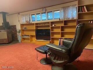 sitting room featuring carpet floors