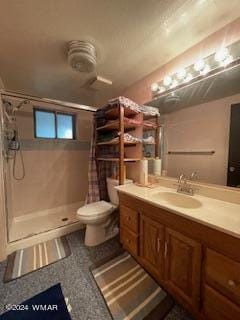 full bath with toilet, a shower stall, and vanity