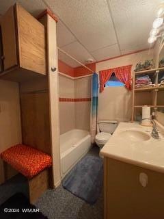 bathroom with shower / bath combo, vanity, and toilet