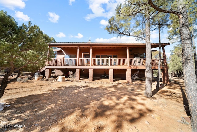 1601 N Stagecoach Cir, Show Low, AZ 85901 - view of front of property with faux log siding, a metal roof, and a wooden deck