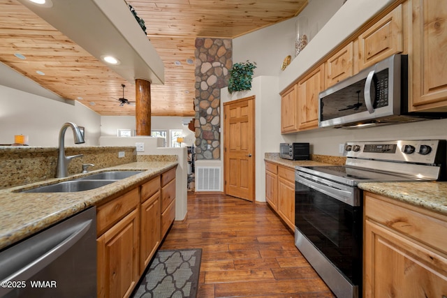 1601 N Stagecoach Cir, Show Low, AZ 85901 - kitchen with appliances with stainless steel finishes, wood ceiling, dark wood-style flooring, light stone counters, and recessed lighting