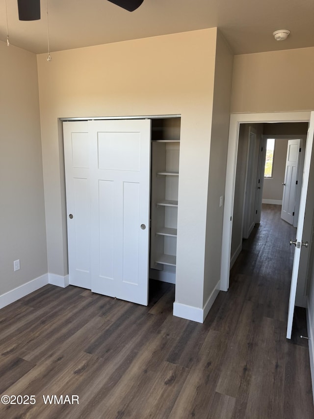 881 S Ridgeway Pl, Show Low, AZ 85901 - unfurnished bedroom with a closet and dark wood-style floors