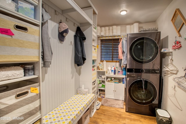 4211 Pinetree Ln, Pinetop, AZ 85935 - clothes washing area with estacked washer and dryer and wood finished floors