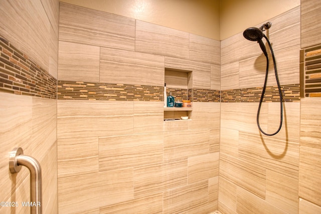 full bath with a tile shower