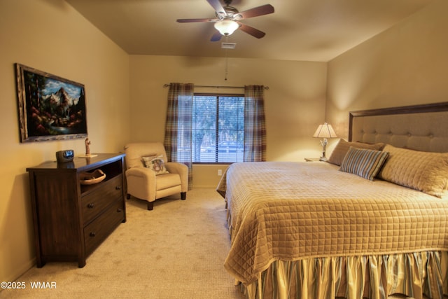 bedroom with light carpet, visible vents, a ceiling fan, and baseboards