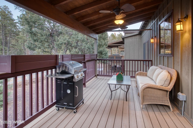 deck with a grill and a ceiling fan