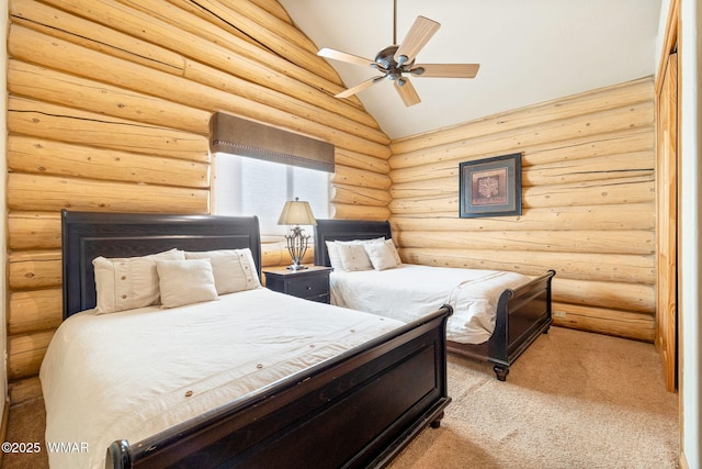 carpeted bedroom with lofted ceiling, ceiling fan, and rustic walls