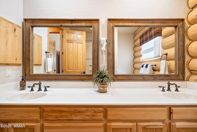 bathroom with double vanity and a sink