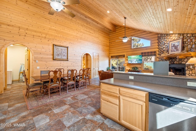 kitchen with ceiling fan, stainless steel dishwasher, and arched walkways