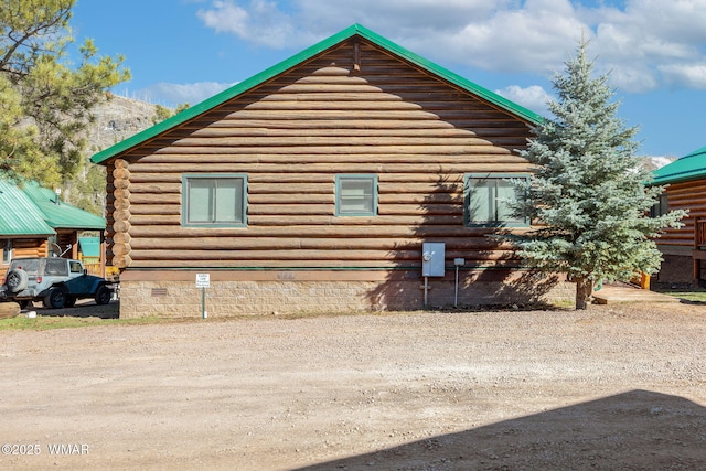view of side of property featuring log siding