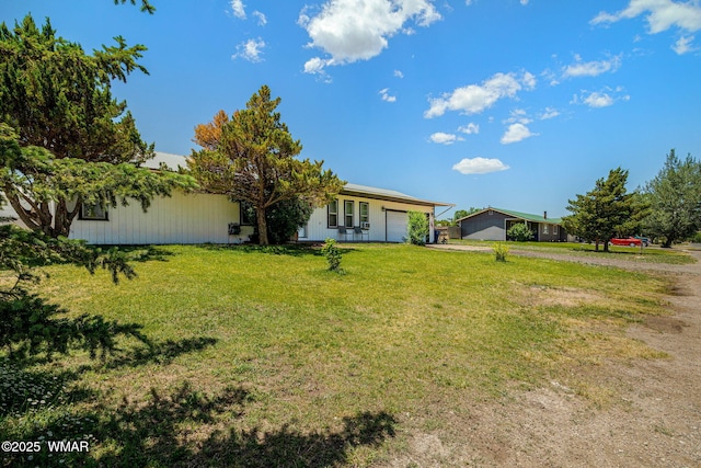 389 E 3rd St, Eagar, AZ 85925 - view of front of home with a garage, driveway, and a front lawn