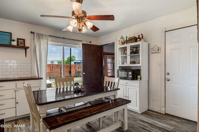 389 E 3rd St, Eagar, AZ 85925 - dining area with ceiling fan, dark wood-style flooring, and a textured ceiling