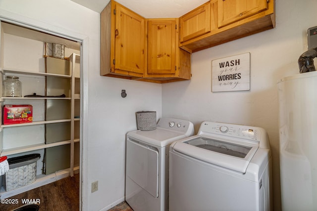 389 E 3rd St, Eagar, AZ 85925 - laundry area featuring washing machine and dryer, cabinet space, water heater, and wood finished floors