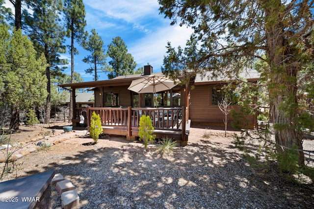 420 N Retreat Way, Show Low, AZ 85901 - view of front of home with a chimney and a wooden deck