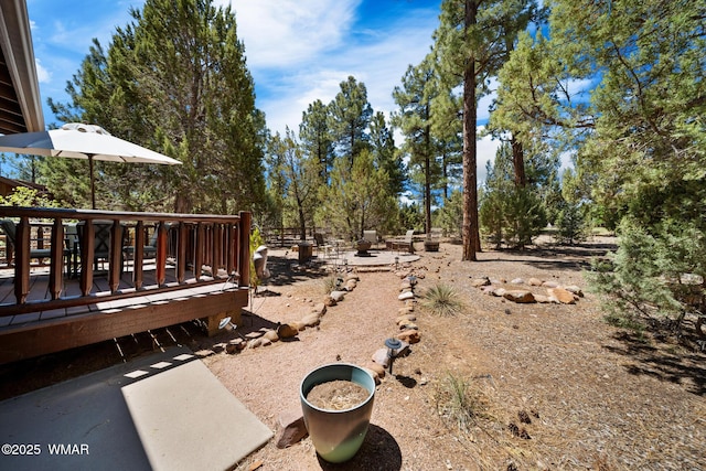 420 N Retreat Way, Show Low, AZ 85901 - view of yard with a wooden deck and a fire pit