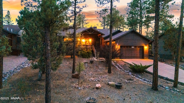 420 N Retreat Way, Show Low, AZ 85901 - view of front of house featuring a garage, driveway, and a chimney