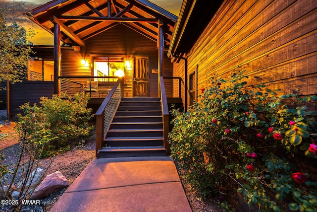 420 N Retreat Way, Show Low, AZ 85901 - exterior entry at dusk with a porch
