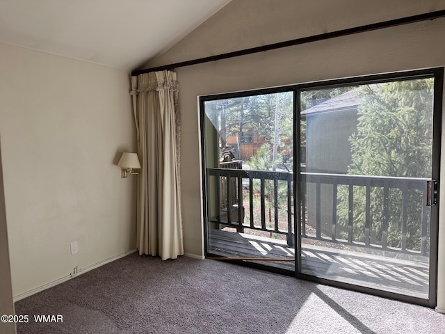 doorway featuring lofted ceiling and carpet floors