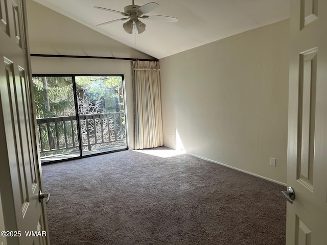 carpeted empty room featuring a ceiling fan and vaulted ceiling