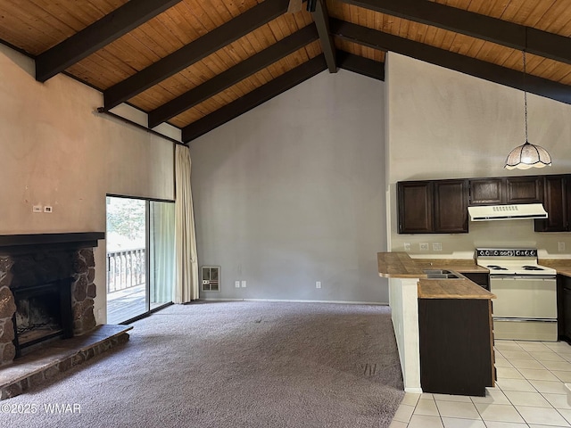 unfurnished living room featuring beam ceiling, a fireplace, heating unit, light colored carpet, and high vaulted ceiling