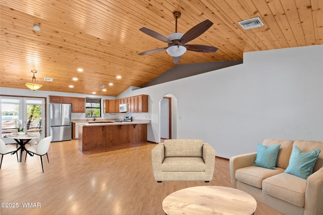 677 Fox Ln, Lakeside, AZ 85929 - living room with wood ceiling, lofted ceiling, recessed lighting, arched walkways, and light wood-style flooring