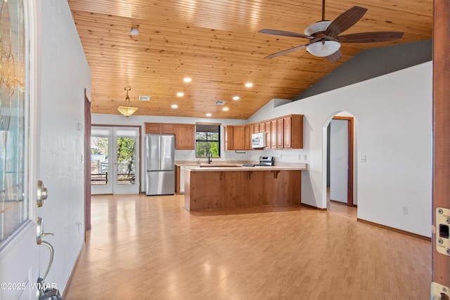 677 Fox Ln, Lakeside, AZ 85929 - kitchen with appliances with stainless steel finishes, wooden ceiling, lofted ceiling, arched walkways, and ceiling fan