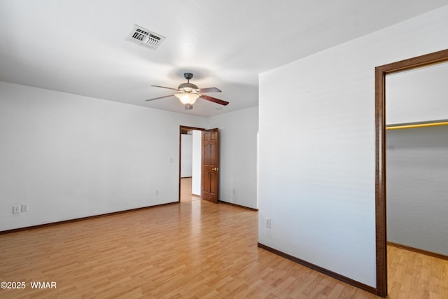 677 Fox Ln, Lakeside, AZ 85929 - spare room with ceiling fan, light wood-type flooring, and baseboards