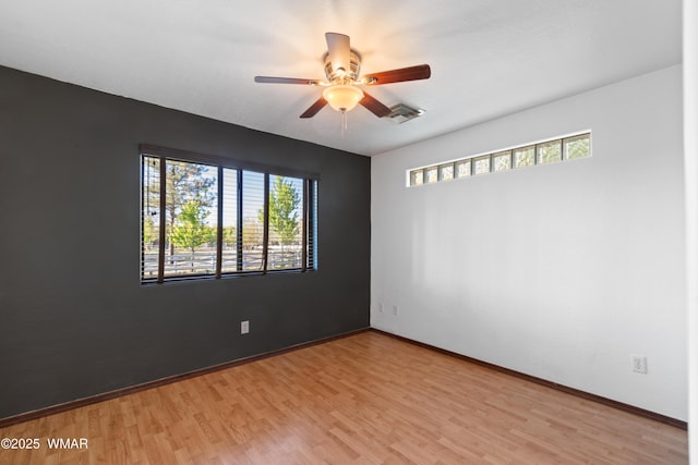 677 Fox Ln, Lakeside, AZ 85929 - spare room with healthy amount of natural light, light wood-style flooring, and a ceiling fan