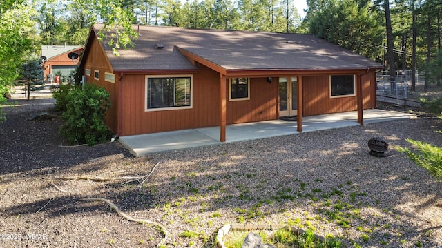 677 Fox Ln, Lakeside, AZ 85929 - back of property with roof with shingles, a patio area, and french doors