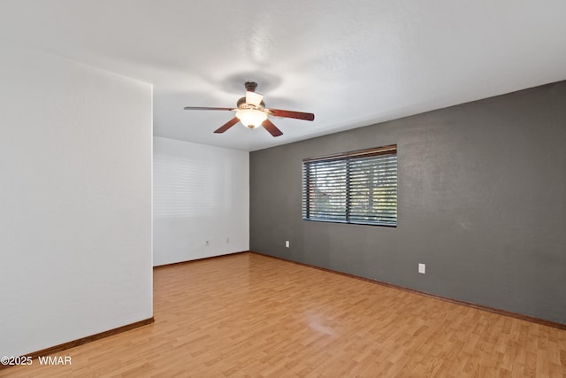 677 Fox Ln, Lakeside, AZ 85929 - spare room with a ceiling fan, light wood-style floors, and baseboards