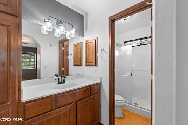 677 Fox Ln, Lakeside, AZ 85929 - full bathroom featuring a shower stall, vanity, toilet, and wood finished floors