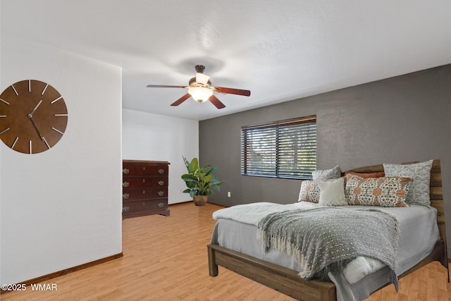 677 Fox Ln, Lakeside, AZ 85929 - bedroom with light wood-style floors, baseboards, and a ceiling fan