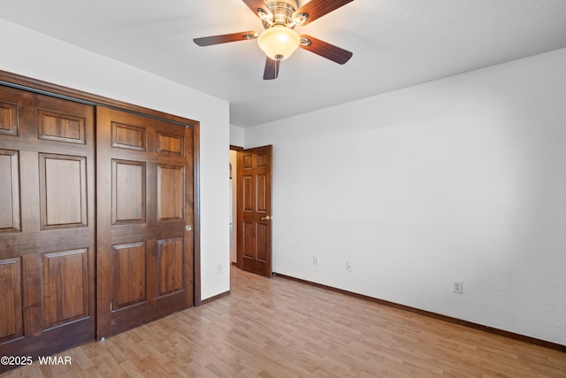 677 Fox Ln, Lakeside, AZ 85929 - unfurnished bedroom with baseboards, light wood-style flooring, and a ceiling fan