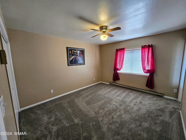 unfurnished room with a baseboard heating unit, dark carpet, baseboards, and ceiling fan