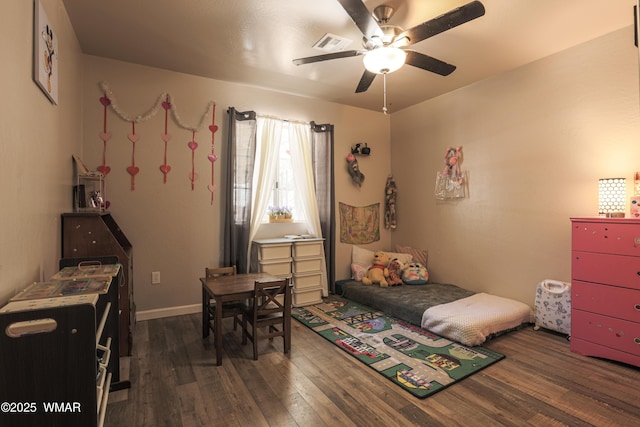 bedroom featuring wood-type flooring and a ceiling fan