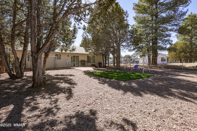 back of property featuring fence