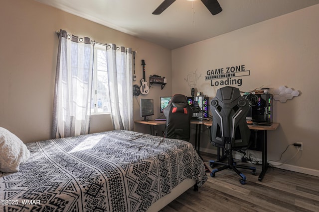 bedroom featuring wood finished floors, baseboards, and a ceiling fan